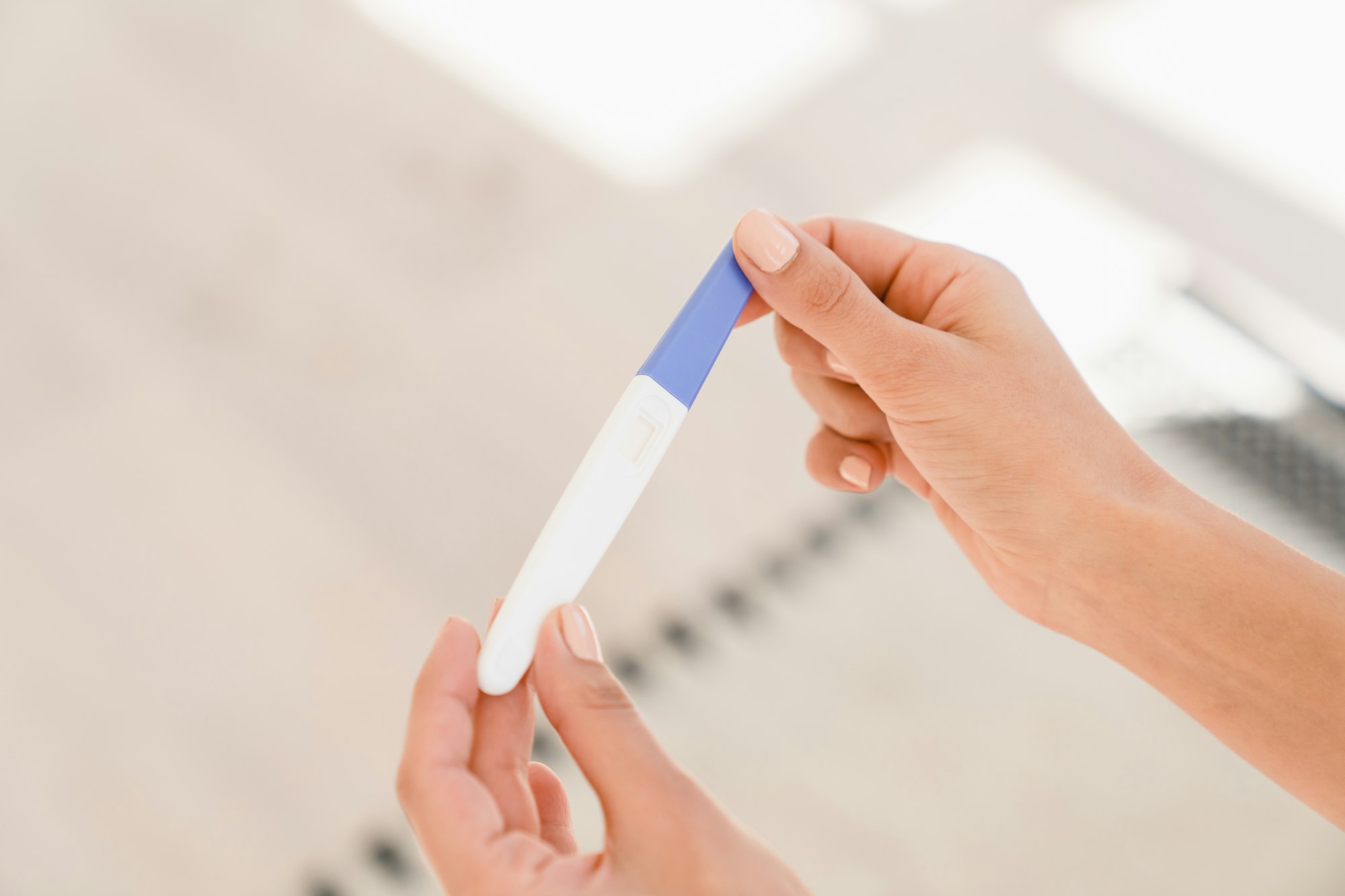 Pregnancy test. Woman female teenager holding pregnancy test, childbirth planning, ovulation